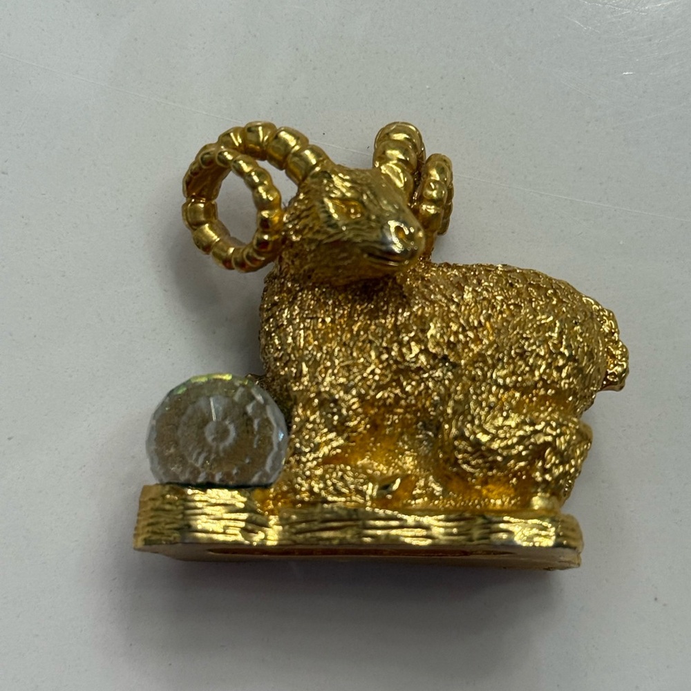 Gold Aries Ram zodiac figure with crystal ball makes an excellent gift